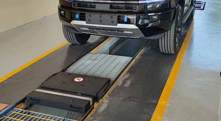 Underbody scanner installed in a drive-through inspection lane